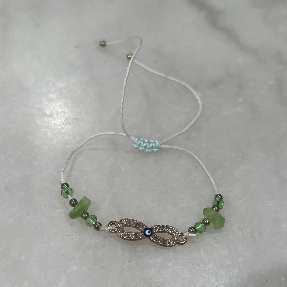 Elegant Green and Gold Infinity Bracelet